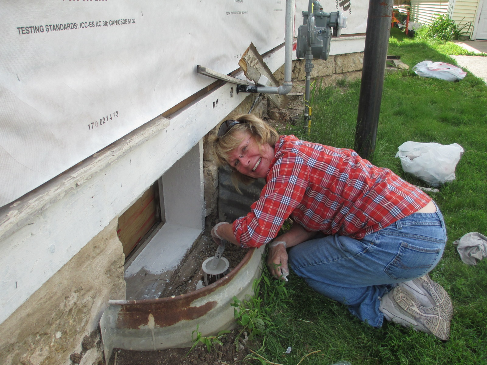 02 Carol Painting basement window seal 2012